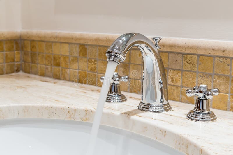 Modern water tap in the bathroom. royalty free stock photo