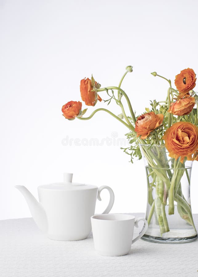Orange Flowers in White Teapot