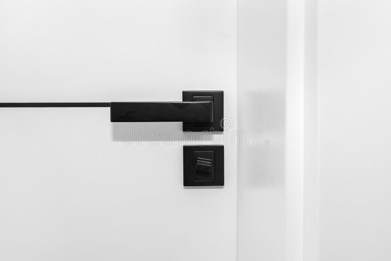 Modern White Door with Matte Black Handle and Locks, Bathroom