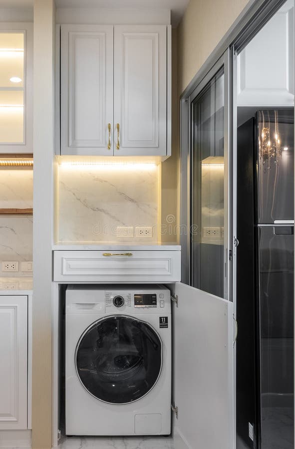 Modern white front-loading washing machine with control buttons. Automatic loading stock images, royalty-free photos and pictures