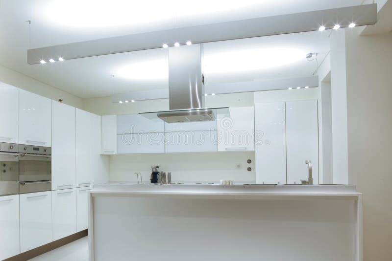 Modern White Kitchen with Wood Floor Stock Photo Image of furnishing