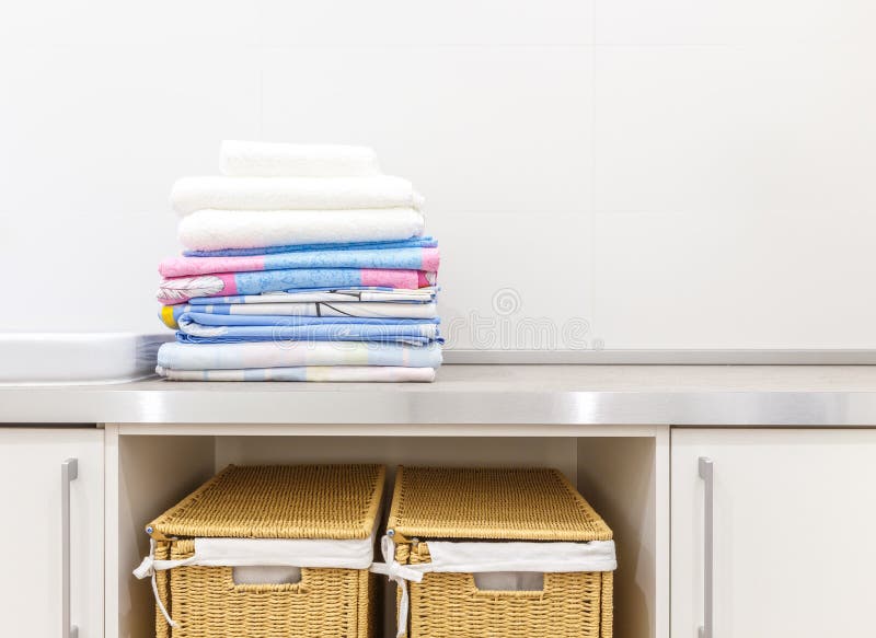 Modern white laundry room with two baskets