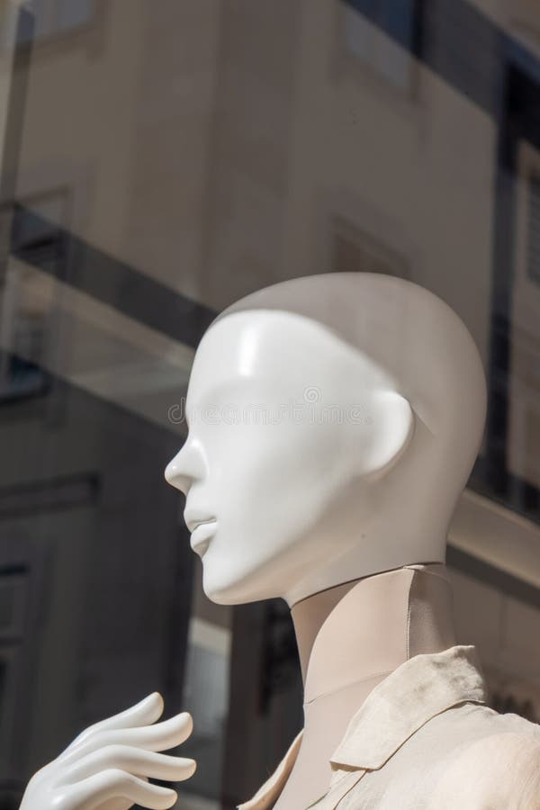 Modern white mannequin profile in storefront window with selective focus vector illustration