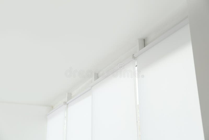 Modern window with white roller blinds stock photo