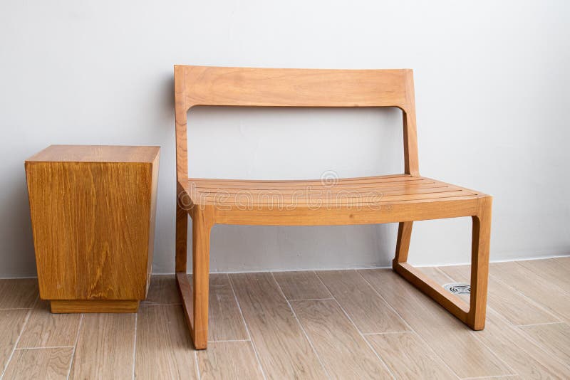 Modern Wood Bench and Wood Side Table with the White Wall Stock Photo