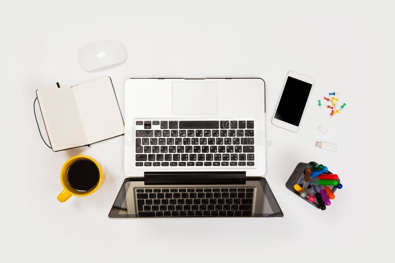 White Office Desk Table With A Lot Of Things On It Top View With