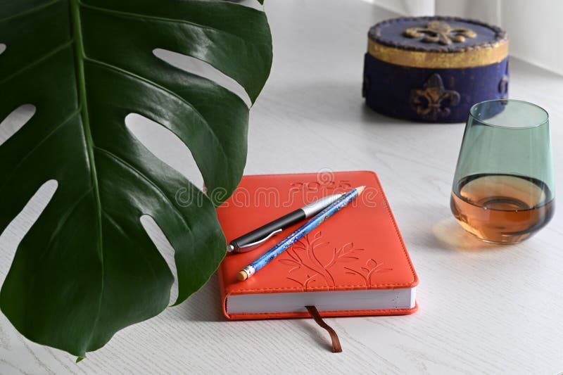 Modern workspace with 2025 planner and glass. royalty free stock photo