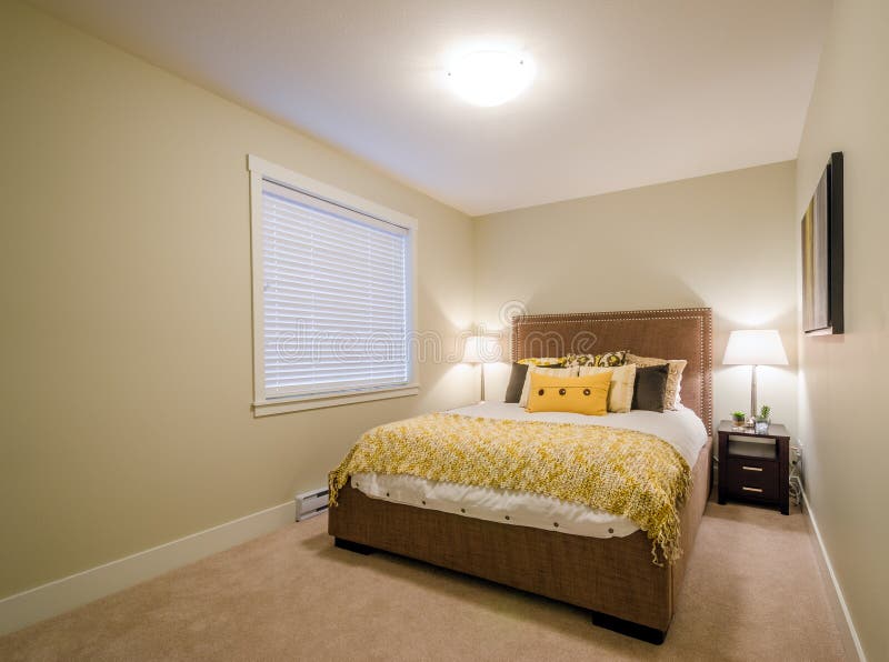 Modern yellow bedroom stock image. Image of decor, lifestyle 75826893