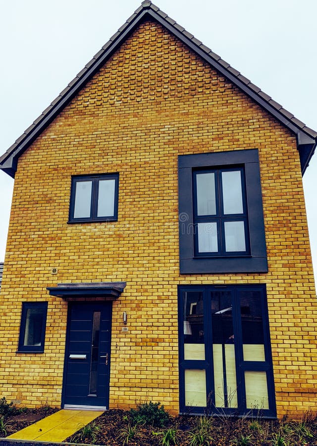 Modern yellow brick house stock photo. Image of brick 171592318