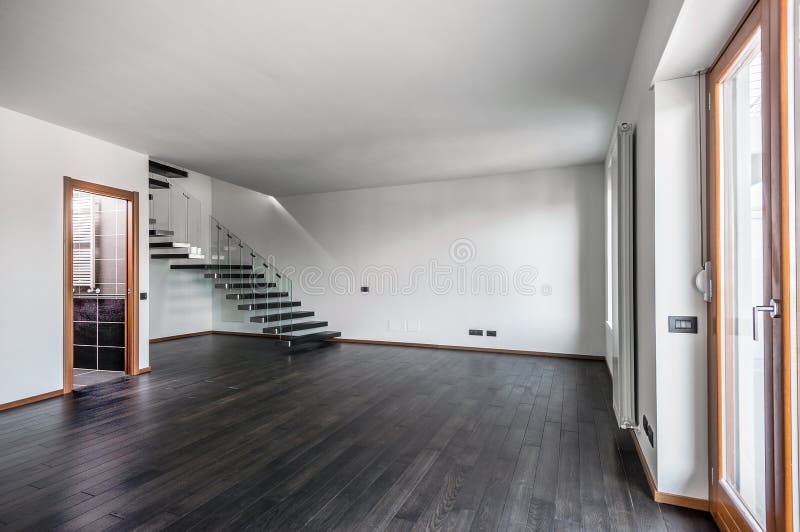 Moderner leerer Innenraum mit dunklem Parkett und Treppenhaus lizenzfreie stockfotografie Moderner leerer Innenraum mit dunklem Parkett und Treppenhaus lizenzfreie stockfotografie