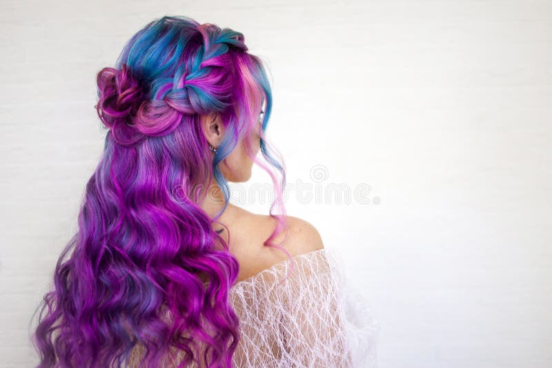 Stylish fashionable young woman with bright hair coloring, Magenta and purple. Beautiful curls, stylish hairstyle for an unusual modern bride. Stylish fashionable young woman with bright hair coloring, Magenta and purple. Beautiful curls, stylish hairstyle for an unusual modern bride