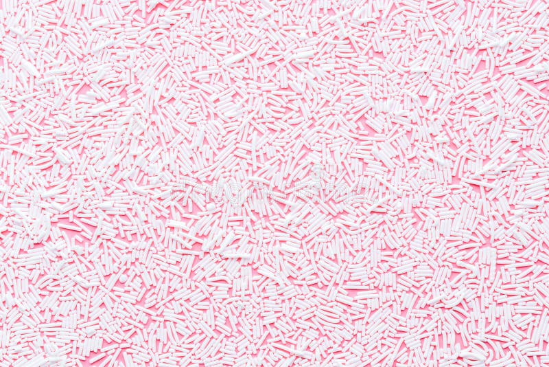 Modisches Muster von Weiß besprüht über rosa Hintergrund Dekoration für Donutglasurhintergrund