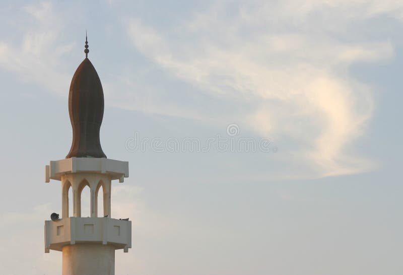 A mosque in Qatar at sunset - the time for the evening prayer call and - during the holy month of Ramadan - the Iftar meal - breaking the Ramadan fast. A mosque in Qatar at sunset - the time for the evening prayer call and - during the holy month of Ramadan - the Iftar meal - breaking the Ramadan fast.