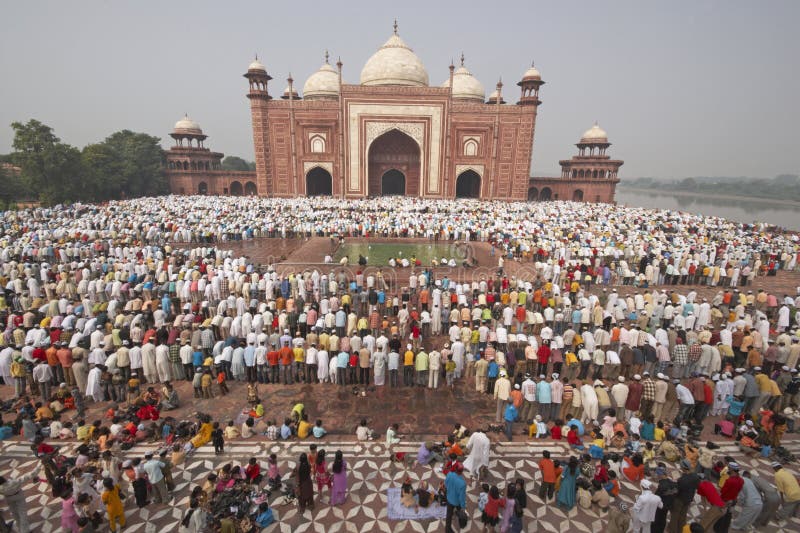 Thousands of people gather in front of the mosque at the Taj Mahal to celebrate the Muslim festival of Eid ul-Fitr in Agra, Uttar Pradesh, India. Thousands of people gather in front of the mosque at the Taj Mahal to celebrate the Muslim festival of Eid ul-Fitr in Agra, Uttar Pradesh, India