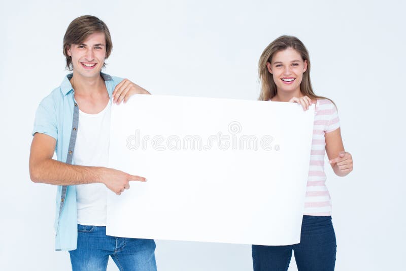 Modniś pary mienia plakat zdjęcia stock