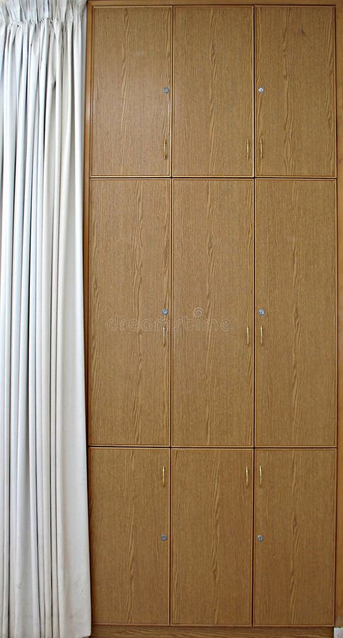 Multiple-compartment cabinet with a curtain on one side. Multiple-compartment cabinet with a curtain on one side.