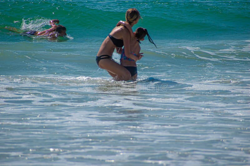Daytona Beach Florida. July 07, 2019 Mother and daughter enjoying and playing with waves 3. Daytona Beach Florida. July 07, 2019 Mother and daughter enjoying and playing with waves 3