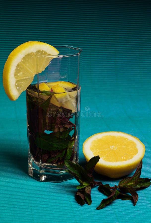 Mojito Cocktail with Lemon and Mint on Blue Background Stock Image ...