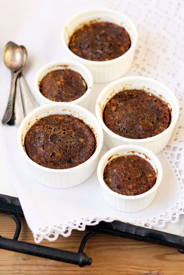 Molasses dessert in ramekins on tray. Dessert portions stock images, royalty-free photos and pictures