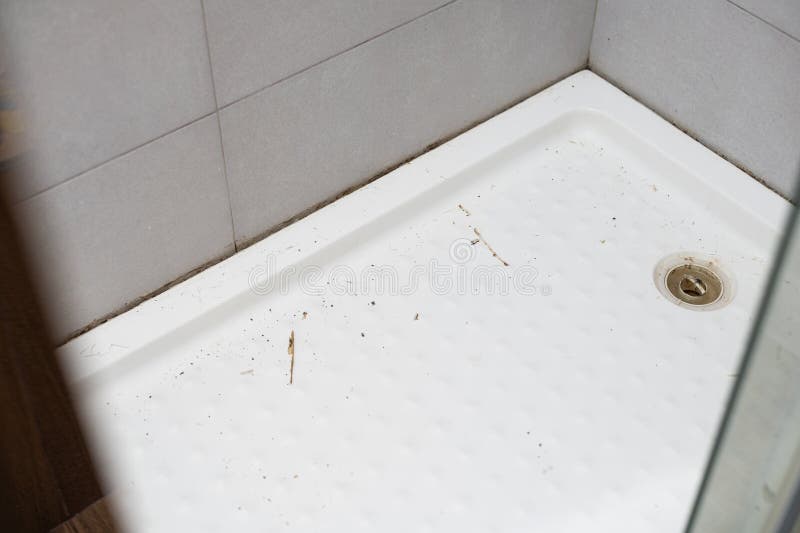 The Mold in the Shower Cabin Corner. Removing the Old Silicone from the