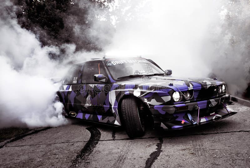 Moldova 25.09.2019. Sport modern Stance E30 BMW Car racing car drifting with smoke drift burnout, big clouds with