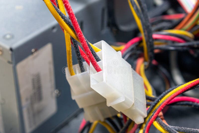 Molex wires in dust in computer system unit close-up plug royalty free stock images