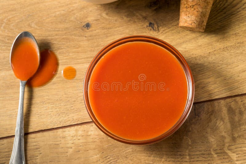 Spicy Hot Organic Red Buffalo Sauce in a Bowl. Spicy Hot Organic Red Buffalo Sauce in a Bowl