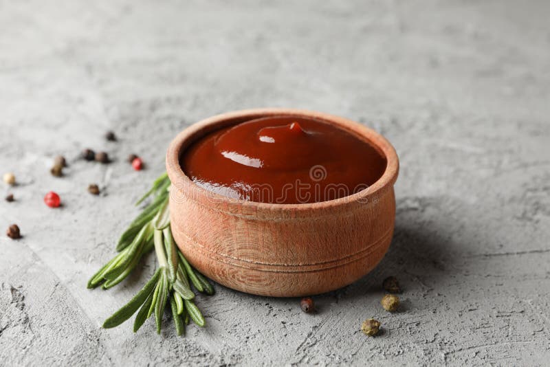 Tasty barbecue sauce, ingredients on grey background, space for text. Closeup. Tasty barbecue sauce, ingredients on grey background, space for text. Closeup