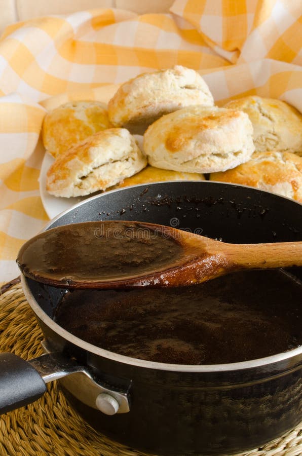 Freshly baked homemade Biscuits (scones) and chocolate sauce. Freshly baked homemade Biscuits (scones) and chocolate sauce