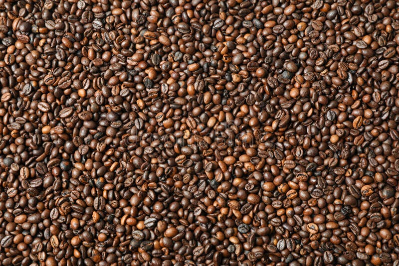Molti chicchi di caffè come fondo, vista superiore immagine stock Molti chicchi di caffè come fondo, vista superiore immagine stock