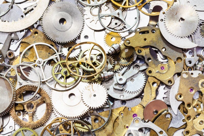 Molti pezzi di ricambio usati dell'orologio vicino su fotografie stock Molti pezzi di ricambio usati dell'orologio vicino su fotografie stock