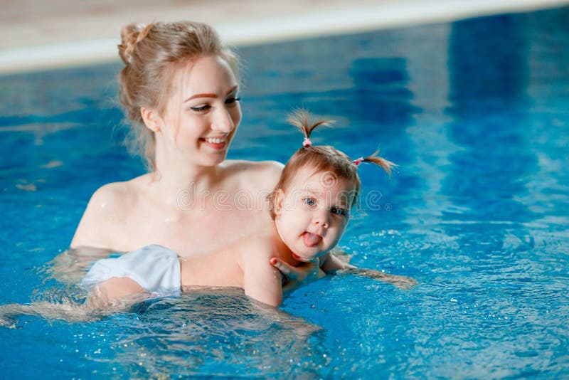 Mom and Baby Swim in the Pool. Stock Image Image of hotel, little