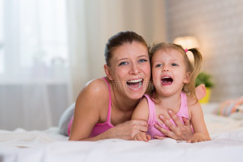 Mom And Daughter In The Bedroom On The Bed Stock Image Image Of