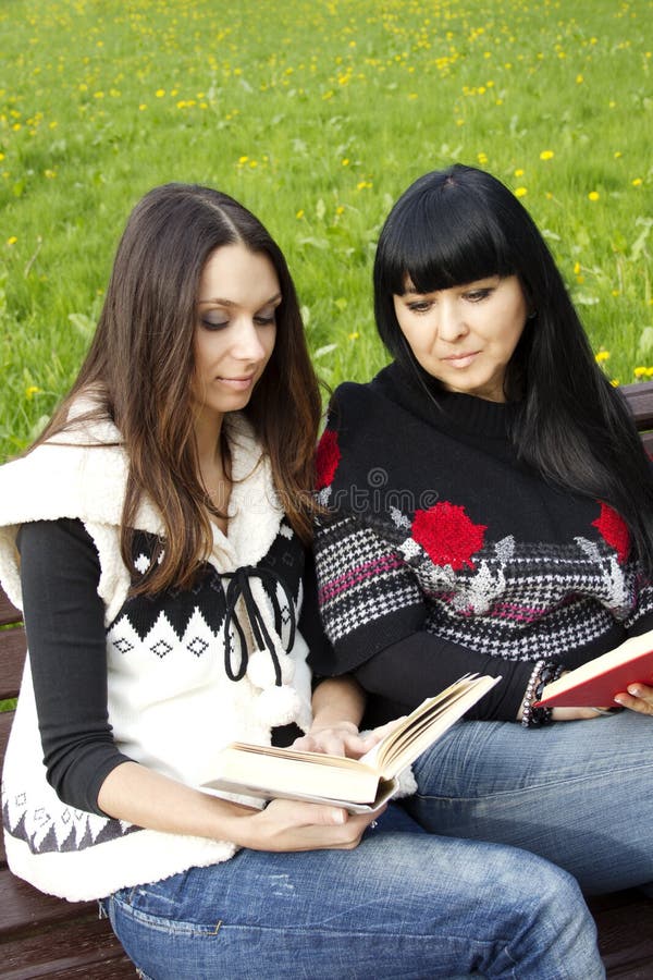 Mom and daughter reading a book