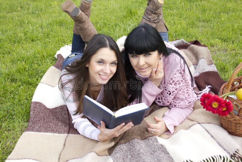 Mom and daughter reading a book