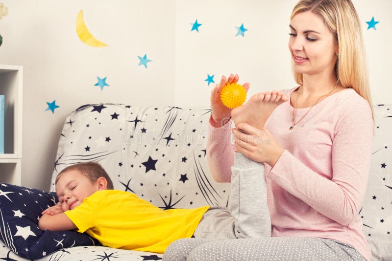 Son Mom Massage Mom Does Foot Massage To Her Son. Stock Image - Image of mother, child: 140031191