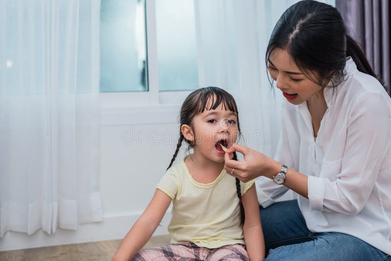 Mom feeding kids with potato chip. Teacher feeding student with