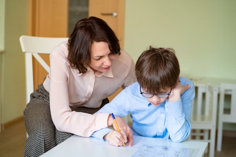 Mom Helps Son Mom Helps Son To Do Homework. Teacher Deals Boy. Stock Image - Image of little, helps: 176783817