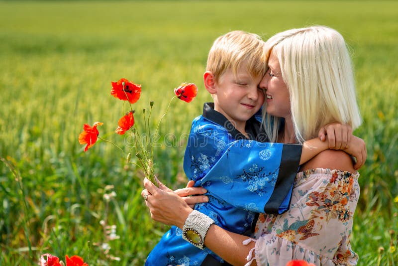 Mom with Her Son in a Magnificent Meadow pic photo