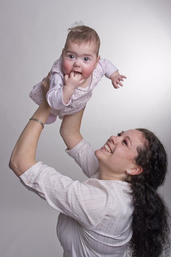 Mom holding baby above her head