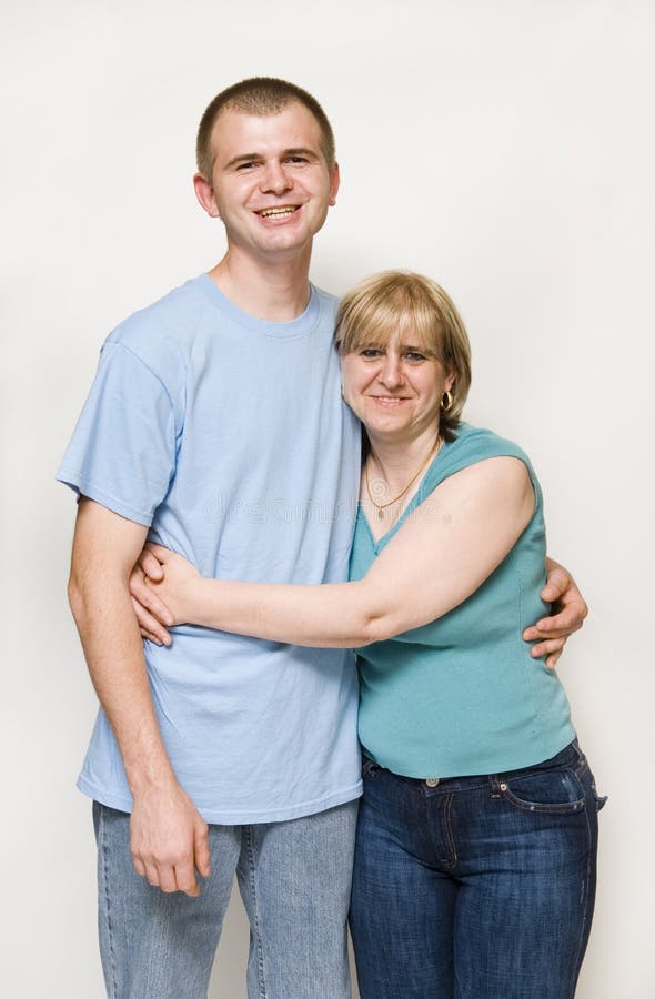 Mom hugging adult son