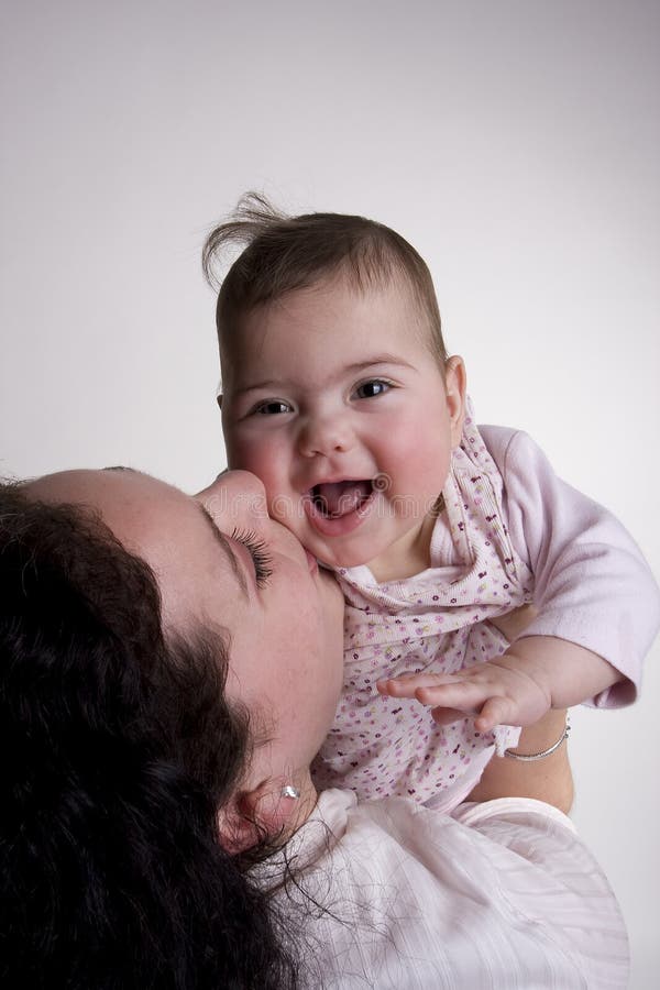 Mom and laughing baby posing