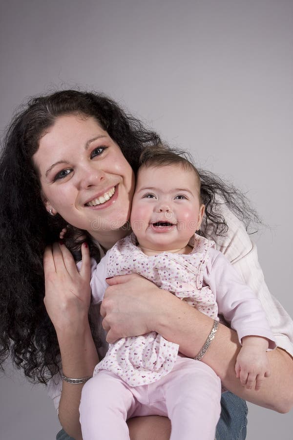 Mom and laughing baby posing