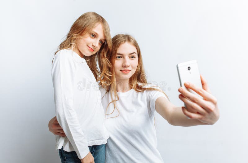 Mom or Older Sister Makes Selfie Little Girl, Happy Family, Photo ...