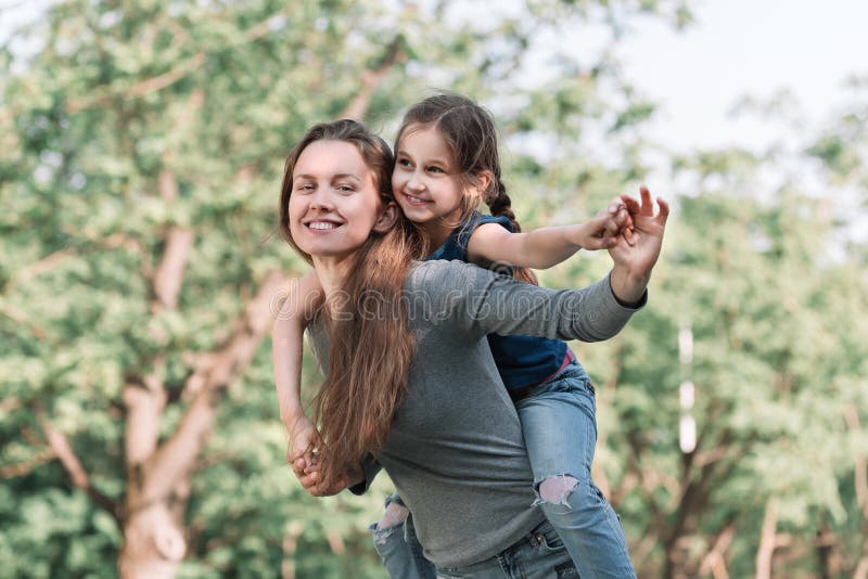 Mom Plays With Her Daughter In The Spring Garden Stock Image Image Of