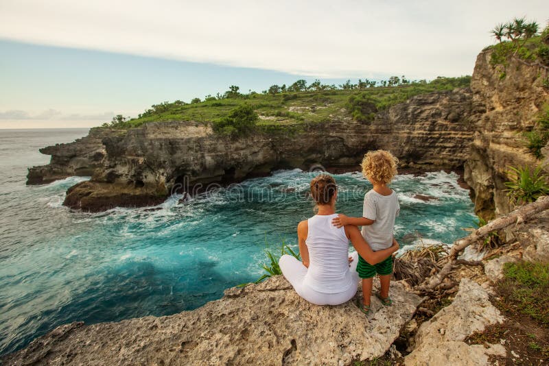 Mom with son by the ocean royalty free stock photos