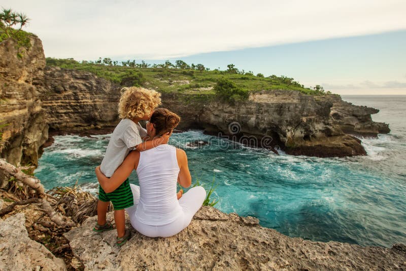 Mom with son by the ocean stock image