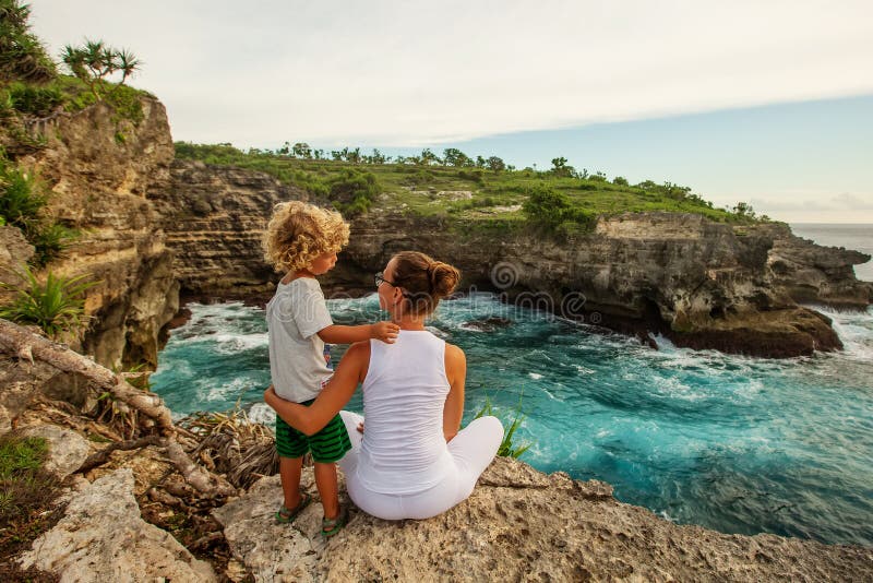 Mom with son by the ocean royalty free stock image