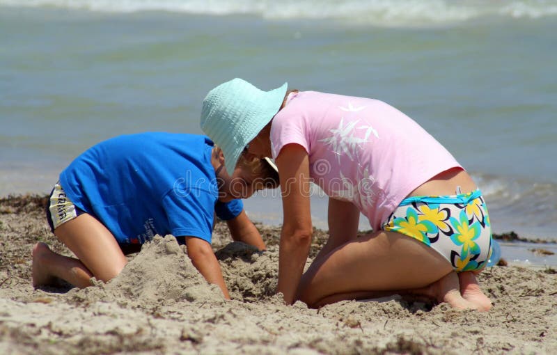 Mom and son playing on beach