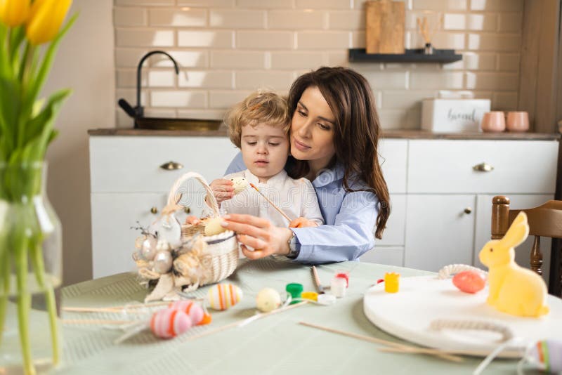 Mom and Son Prepare an Easter Basket. Stock Image Image of little